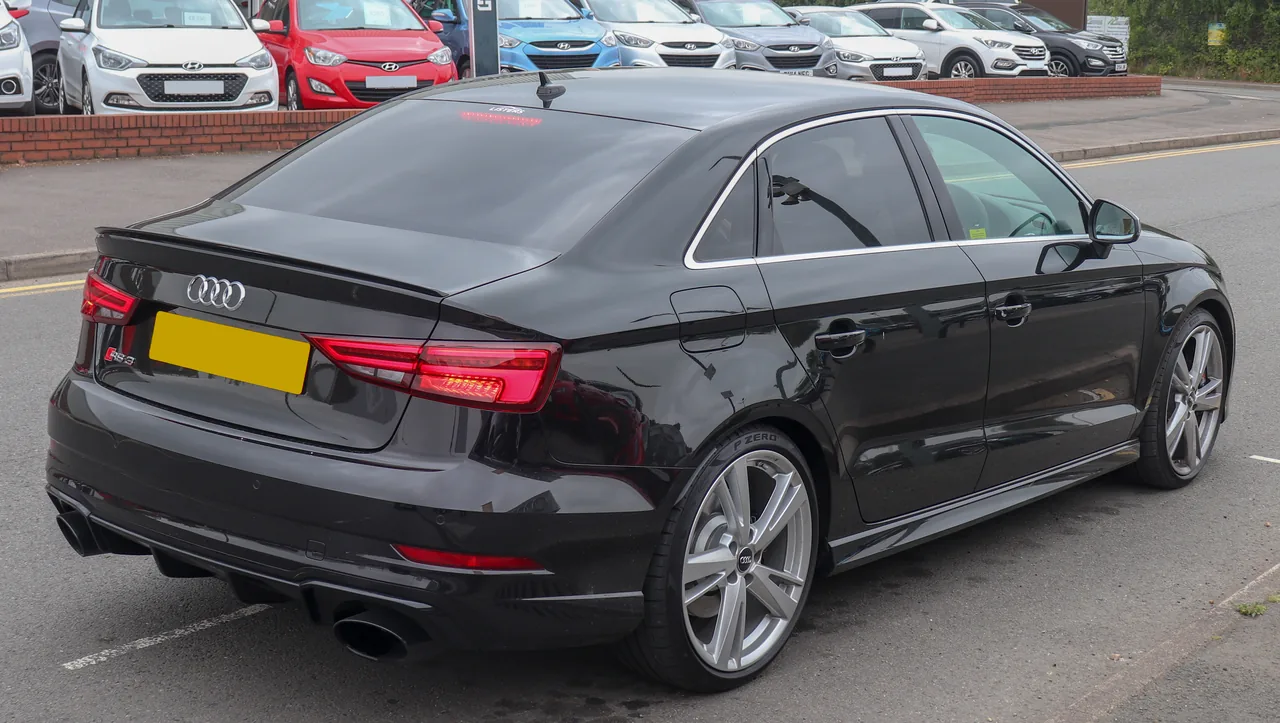 Dark Audi RS3 saloon photographed on a road in Stratford-upon-Avon